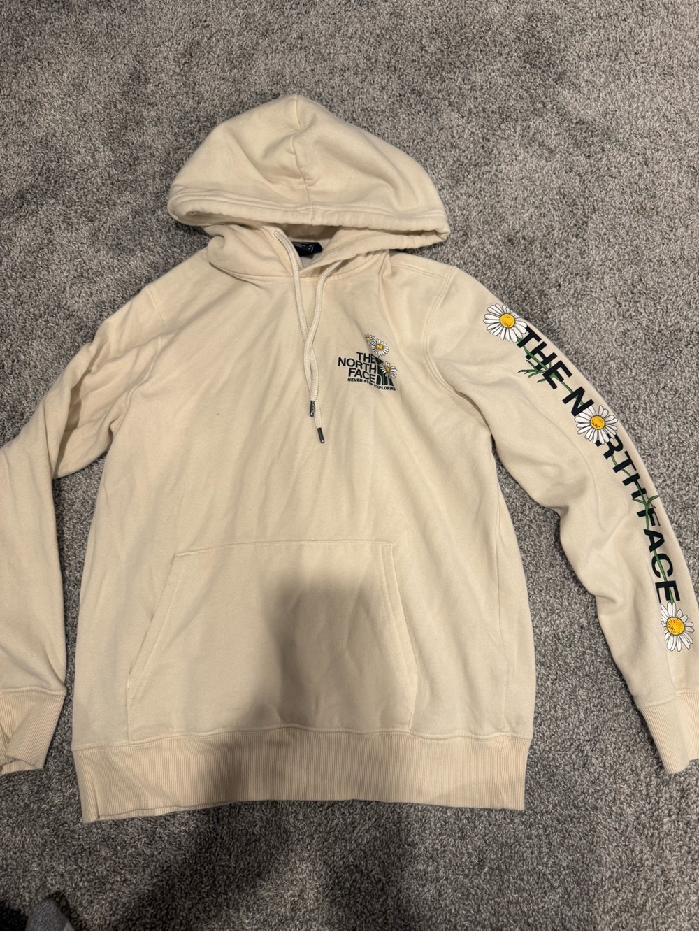 The North Face women’s Cream Hoodie with Daisy Sleeve Logo